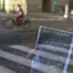 A man reads a newspaper with a headline reading “War in the heart of Paris” in a hotel lobby in Paris, France, Saturday, Nov. 14, 2015.